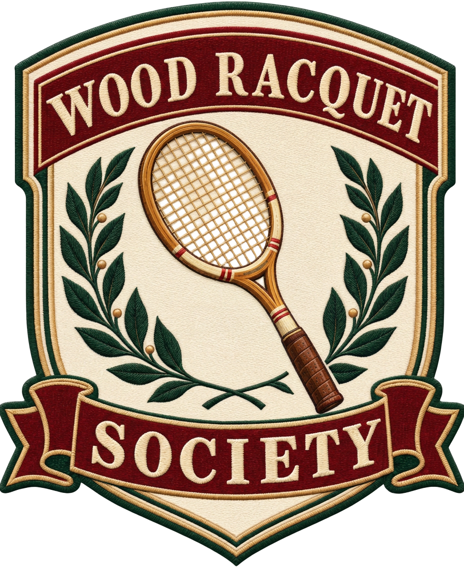 Wood Racquet Society embroidered crest with a wooden tennis racquet and laurel branches